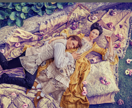 18th century grand costume-clad actors lying down