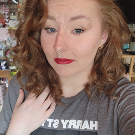 young caucasian woman with wavy auburn hair