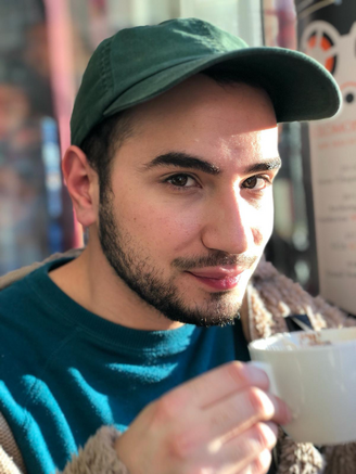 Young man with facial hair and cap